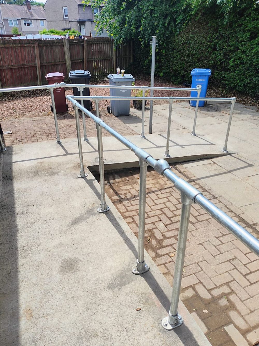 Finished work: the ramp, turning area and metal handrails.